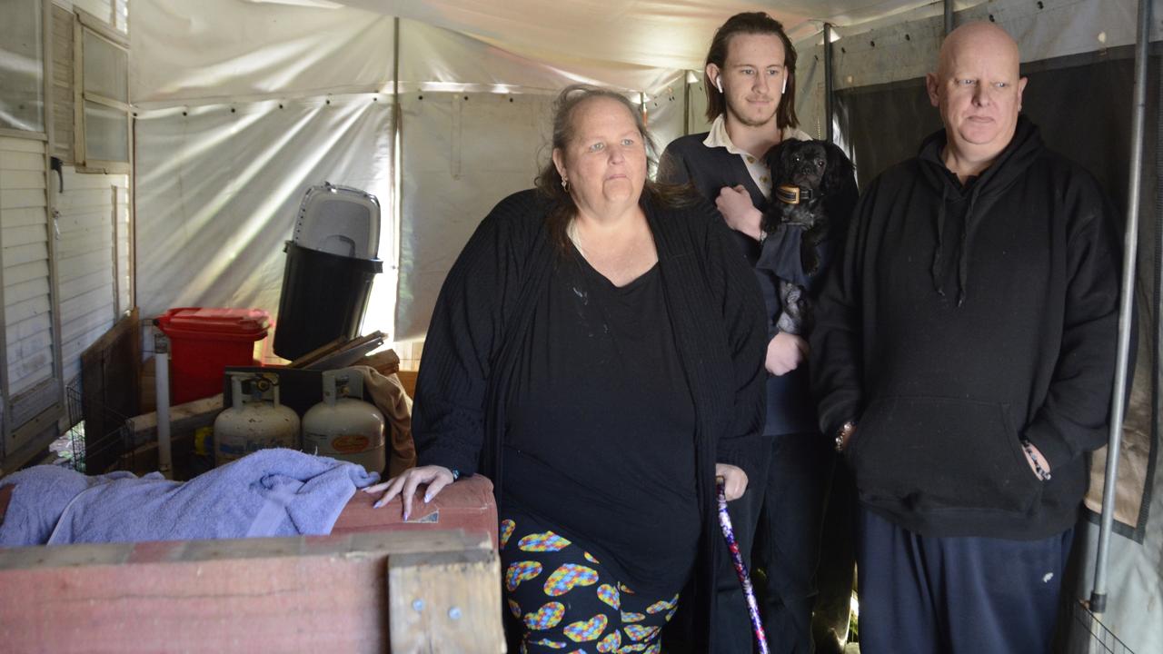 Patricia, Daniel-John and Donald Weir in the caravan they've been living in for nine months as they struggle to find rental accommodation in Toowoomba.