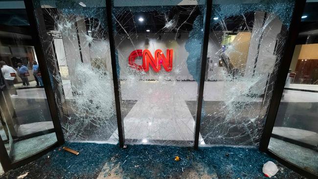 A glass wall stands shattered at the CNN headquarters in the aftermath of rioting and protests in Atlanta.