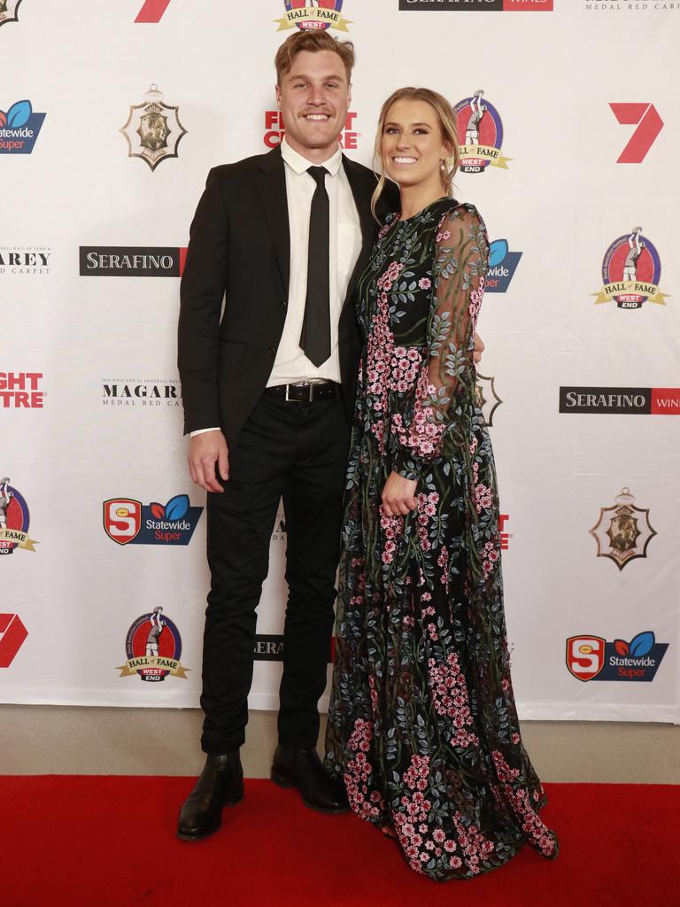 Sam Colquhoun and Kate Graves, wearing ASOS, pose for a picture on the red carpet at Adelaide Oval in North Adelaide, for the Magarey Medal, Monday, September 9, 2019. Picture: Matt Loxton