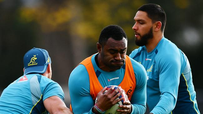 Tevita Kuridrani is tackled by Billy Meakes and Curtis Rona during training.