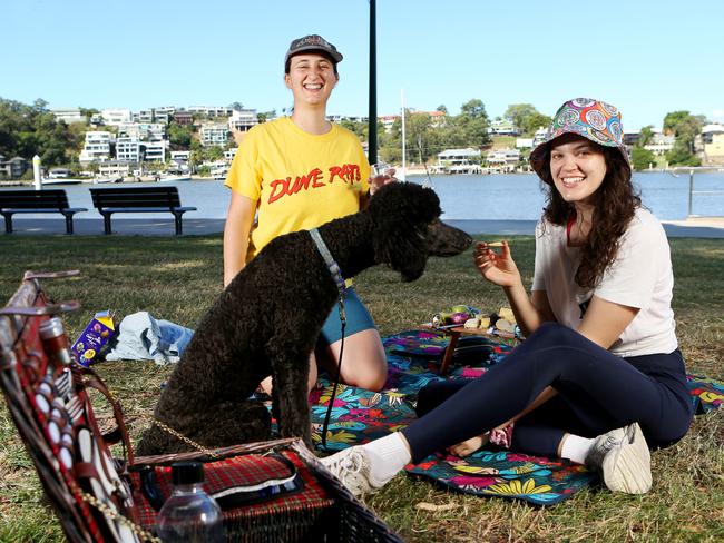 Caitlin Dauth from Annerley with Emma Hambleton from the Gap and the dog Cleo. Picture: Steve Pohlner