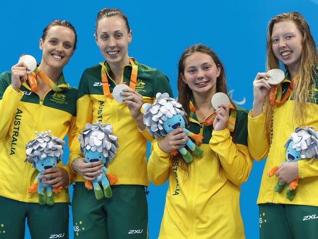 RIO DE JANEIRO, BRAZIL - SEPTEMBER 16: Silver medalists Ellie Cole, Madeleine Scott, Maddison Elliott and Lakeisha Patterson of Australia pose on the podium at the medal ceremony for the Women's 4x100m Medley Relay - 34 Points on day 9 of the Rio 2016 Paralympic Games at the Olympic Aquatic Stadium on September 16, 2016 in Rio de Janeiro, Brazil. (Photo by Buda Mendes/Getty Images)