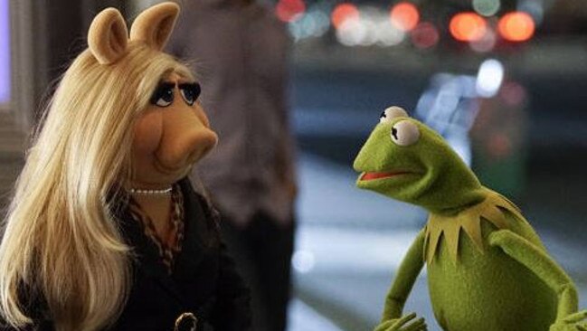 In the new Muppets, Kermit and Miss Piggy are trying to co-exist as co-workers.