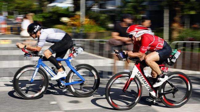 Lyndon Kendrick and Andrew Cosgrave complete the cycle leg in the Ironman Cairns 70.3 race. Picture: Brendan Radke