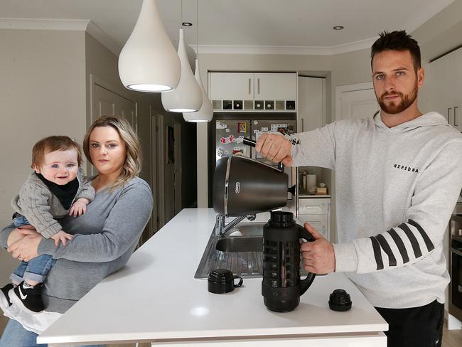 Janelle Frew with son Myles, 10 months and partner Nathan Palibrk at home in Plumpton. Picture: Ian Currie