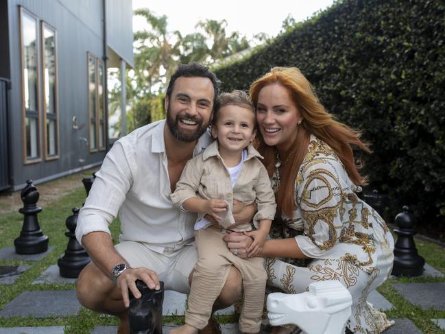 Jules Robinson and Cam Merchant with their son Ollie. Picture: Russell Shakespeare.