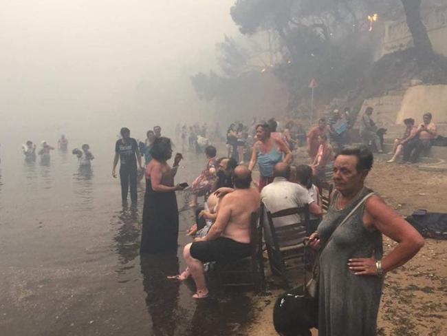 People took refuge from Greece fires in Argyris Akti, Nea Makri, Greece. Picture: Kalogerikos Nikos / Forecast weather Greece