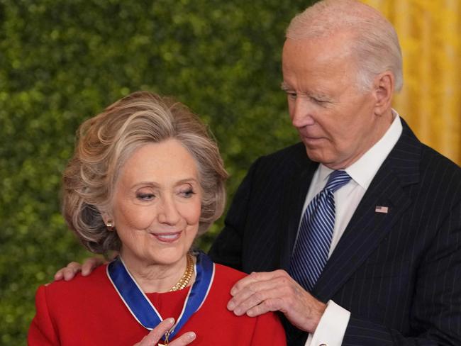 Hillary Clinton receives the Medal of Freedom from United States President Joe Biden during a ceremony at the White House in Washington, DC, January 4, 2025. (Photo by Chris Kleponis / AFP)