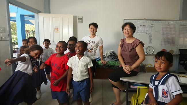 Chung Wah school board member Wendy Ho with teacher Jackie Zheng and students. Picture: Vanessa Hunter