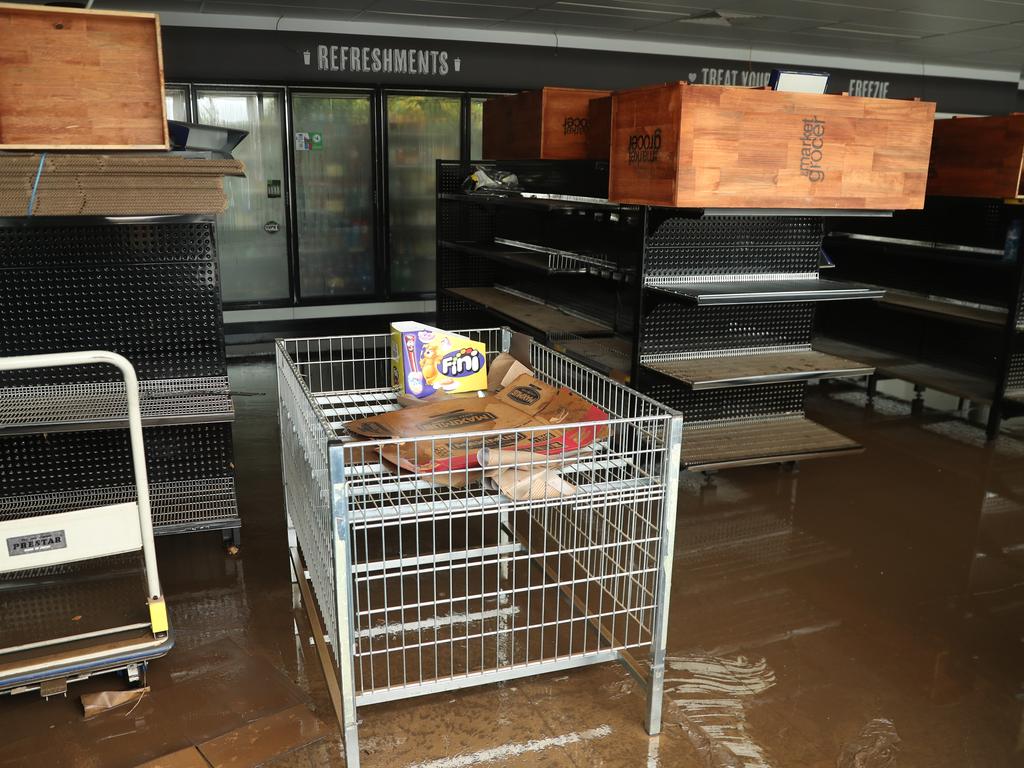 Camden a day after another flood in the area in two weeks . The BP service station and another were damaged again .