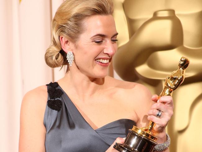 Kate Winslet poses after winning the Best Actress award for The Reader.