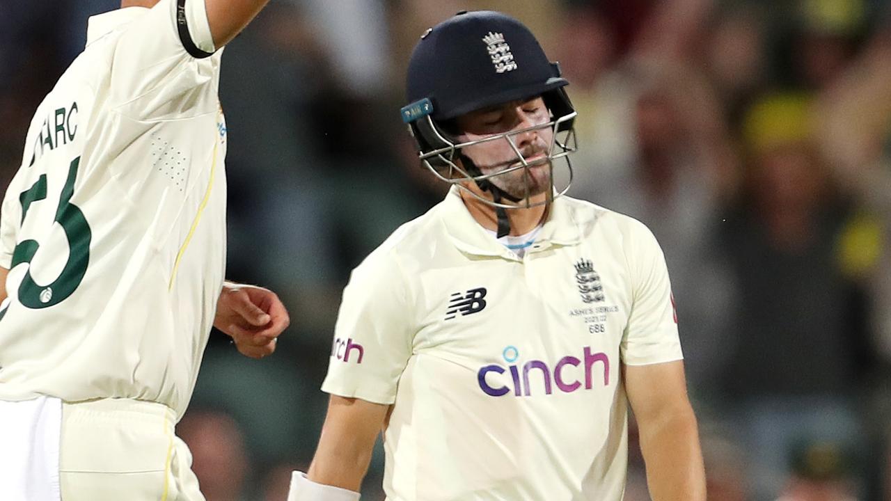 ADELAIDE, AUSTRALIA - DECEMBER 17: Mitchell Starc of Australia celebrates the wicket of Rory Burns of England, out caught and bowled for 4 runs during day two of the Second Test match in the Ashes series between Australia and England at Adelaide Oval on December 17, 2021 in Adelaide, Australia. (Photo by Sarah Reed - CA/Cricket Australia via Getty Images)