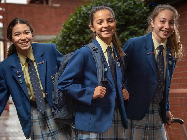 Walford anglican school for girls students Sasha King 11, Ava Maios 12 and Ranae Scarpin 11 have pitched the idea to move from traditional school bags to roller bags as part of the school's own 'festival of ideas'. Picture: Brad Fleet