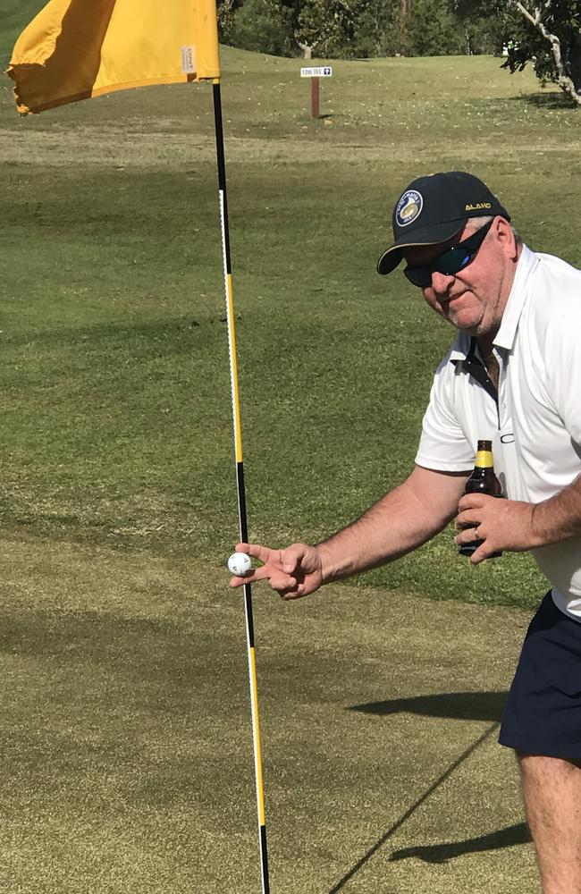 Brendan Payne holds up his ball after his hole-in-one on the 11th at Maclean Golf Club. Photo: Miles James