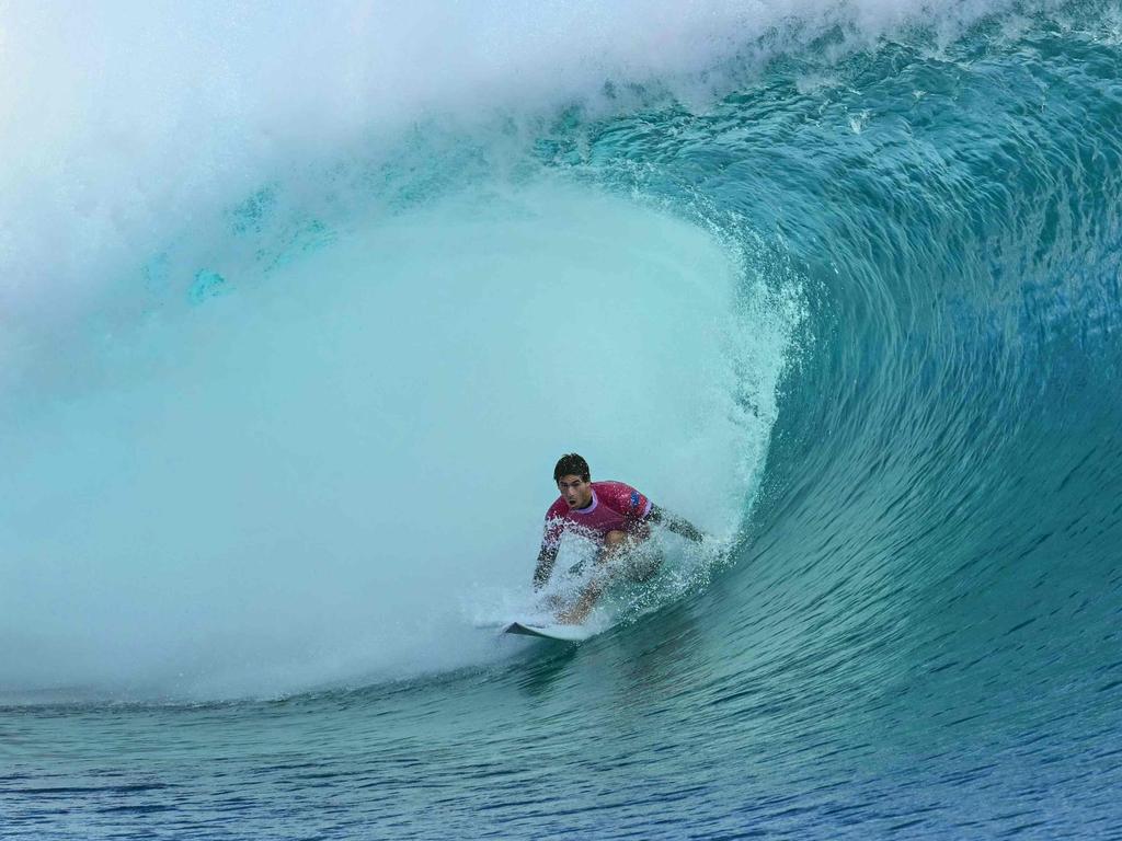 Australia's Jack Robinson rides in a barrel. Picture: Jerome BROUILLET / AFP