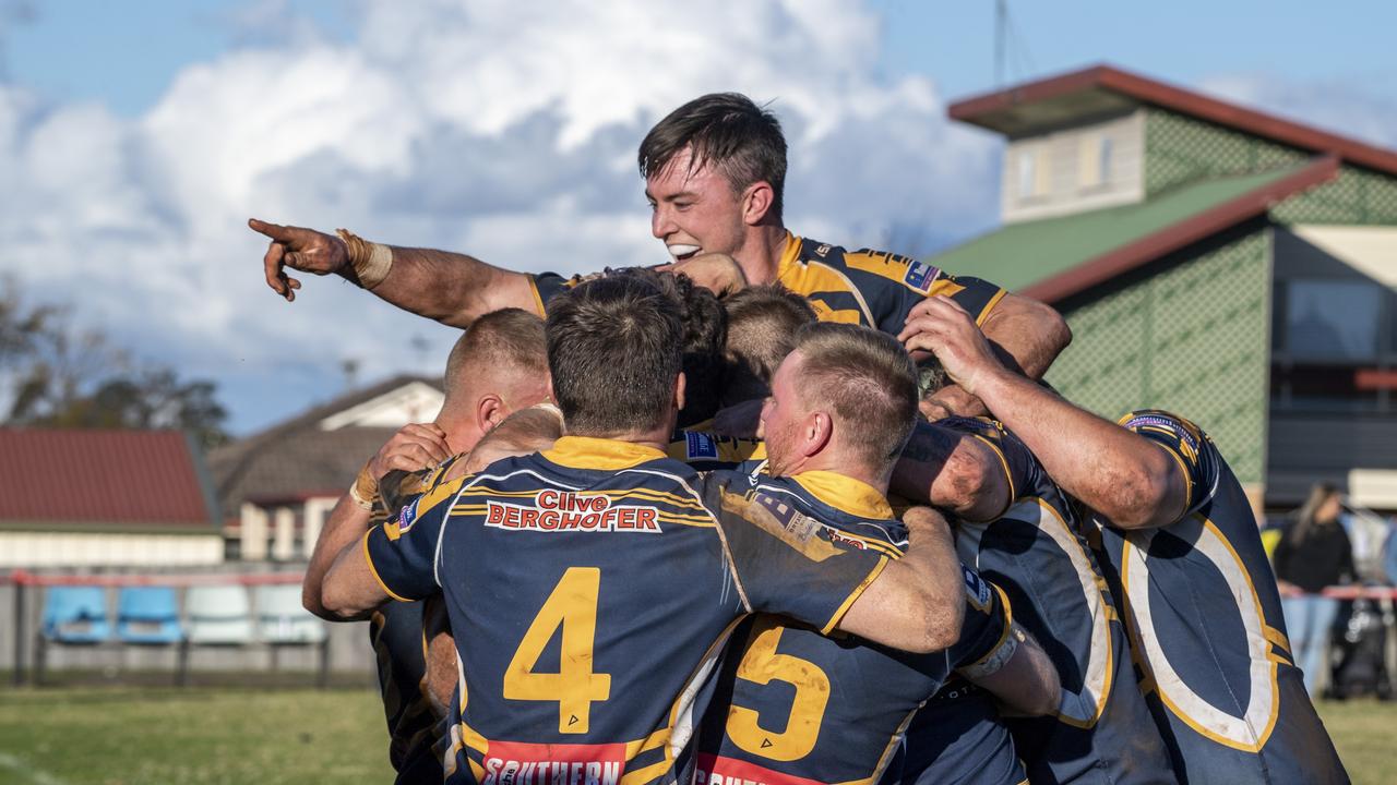 Conor Nolan for Highfields celebrates with his teammates. Picture: Nev Madsen