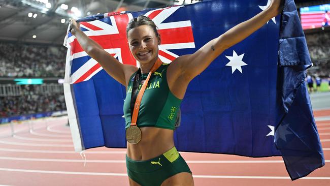 First-placed Australia's Nina Kennedy celebrates as she shares the gold medal with USA's Katie Moon after recording the same height in the women's pole vault final during the World Athletics Championships at the National Athletics Centre in Budapest on August 23, 2023. (Photo by ANDREJ ISAKOVIC / AFP)