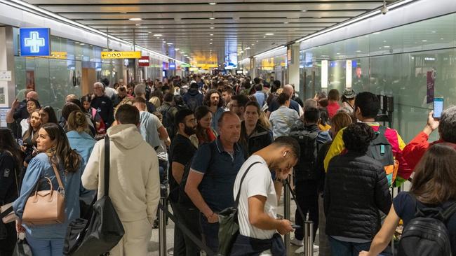 Travellers wait in a long queue to pass through the security check at Heathrow on June 1. (Photo by Carl Court/Getty Images)