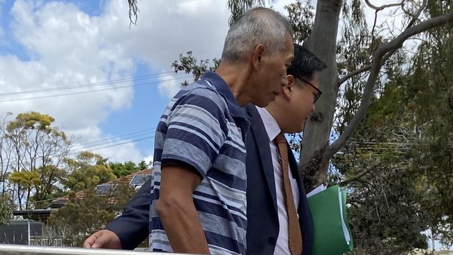 Fernandes Chang Castillo (left) leaves Holland Park Magistrates Court with his lawyer.