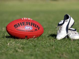 Generic AFL Sherrin football and football boots. sport /