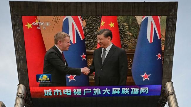 An outdoor screen shows news coverage of New Zealand's Prime Minister Chris Hipkins meeting with China's President Xi Jinping at the Great Hall of the People, along a street in Beijing. Picture: AFP