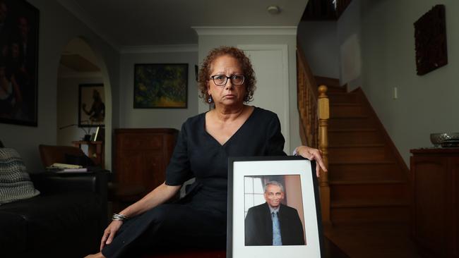 Di Bonarius with a picture of her father Lalin Fernando, who was shot dead by her mentally ill sister in 2010. Picture: John Feder