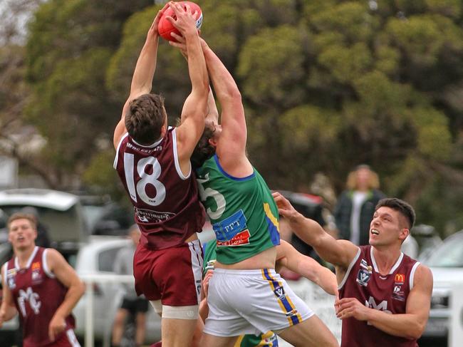 Melton's Liam Carter marks over the top of Liam Hepworth. Picture: Aaron Cook