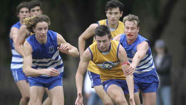 Sacred Heart's Riley Holder ahead of St Peter'’ opponents. Picture: AAP/Dean Martin)