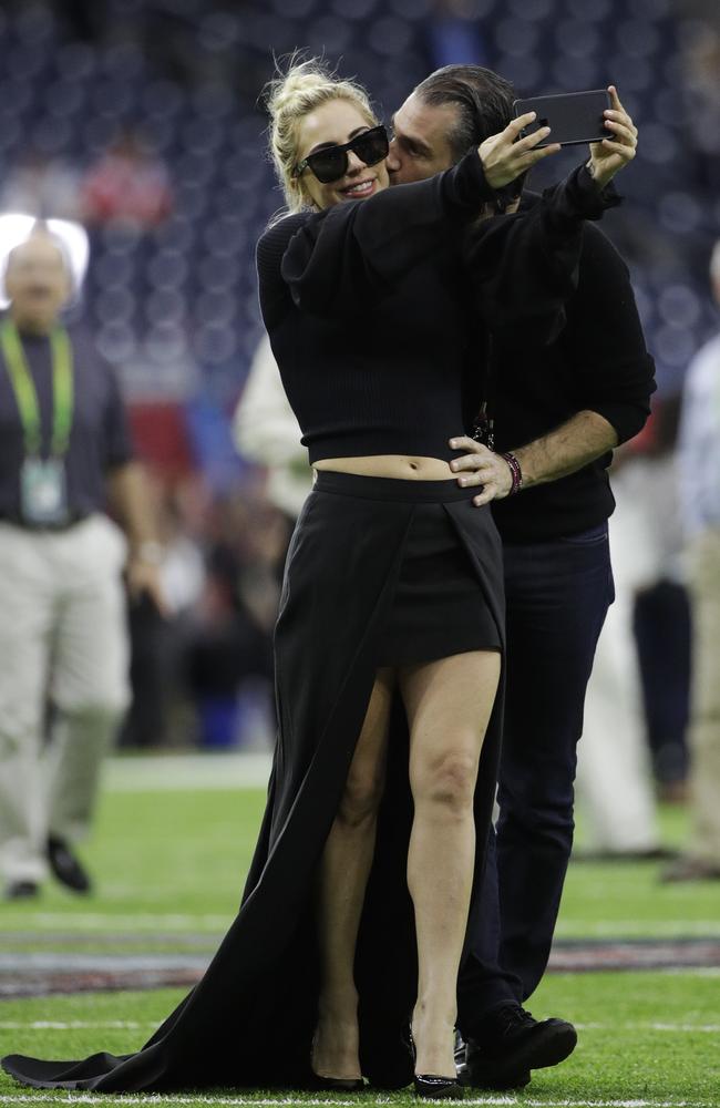 Lady Gaga takes a selfie with rumoured new boyfriend Christian Carino before the Super Bowl on February 5th. Picture: AP/Jae C. Hong