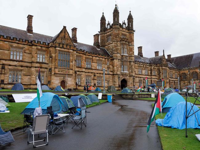 SYDNEY, AUSTRALIA - NewsWire Photos JUNE 15 2024. Scenes of pro-gaza & Palestine tent camp on the lawn of Sydney University. The uni has ordered the pro-Palestinian encampment to pack up and leave campus eight weeks after the tent protest appeared on its lawns. Picture: NewsWire / Max Mason-Hubers