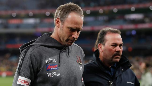 Essendon coach Ben Rutten walks off the MCG after Saturday night’s loss. Picture: Dylan Burns/AFL Photos