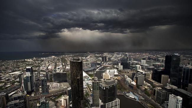 The storm front hits Melbourne. Picture Norm Oorloff