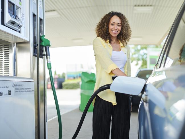 woman filling up at the petrol pump