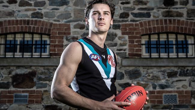 ADELAIDE, AUSTRALIA - JULY 25: Connor Rozee of Port Adelaide Power poses during a media opportunity ahead of his 100th AFL match, at Port Adelaide on July 25, 2023 in Adelaide, Australia. (Photo by Sarah Reed/Getty Images)