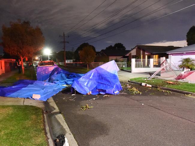 Rescue workers at the site of the crash. Picture: Tony Gough