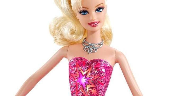 All-American girl ... Mattel has stirred the pot again by taking Barbie out of her fairytale dress and into a swimsuit for the cover of Sports Illustrated.