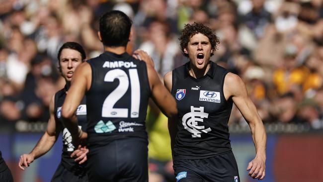 MELBOURNE, AUSTRALIA - AUGUST 11: Charlie Curnow of the Blues celebrates kicking a goal during the round 22 AFL match between Carlton Blues and Hawthorn Hawks at Melbourne Cricket Ground, on August 11, 2024, in Melbourne, Australia. (Photo by Daniel Pockett/Getty Images)