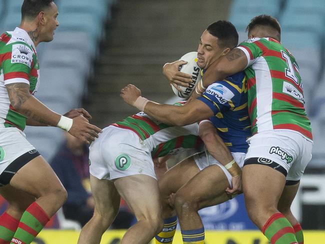 Jarryd Hayne is hammered by two Rabbitohs. Picture: AAP