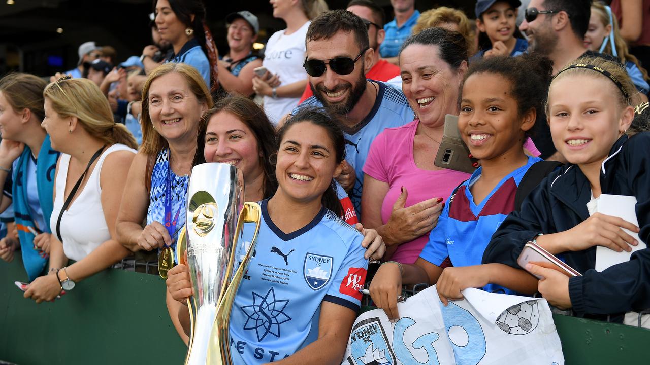 Teresa Polias of Sydney poses for photographs with supporters after winning the W-League last season. (AAP Image/Dan Himbrechts)