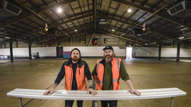 Beer and Barbecue Festival organiser Gareth Lewis, right, and Aaron Sandow after packing up the hall on Tuesday. Picture: Roy Van Der Vegt