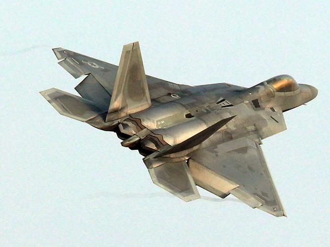 A US Air Force F-22 Raptor stealth jet flies over a South Korean air base in Gwangju on December 4, 2017. The US and South Korea on December 4 kicked off their largest ever joint air exercise, an operation North Korea has labelled an "all-out provocation", days after Pyongyang fired its most powerful intercontinental ballistic missile. / AFP PHOTO / YONHAP / - /  - South Korea OUT / NO ARCHIVES -  RESTRICTED TO SUBSCRIPTION USE