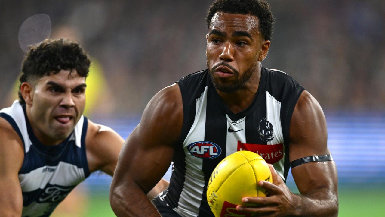 Geelong’s Tyson Stengle, attempting to quell Collingwood’s Isaac Quaynor, is having a career-best season for tackles. Picture: Quinn Rooney/Getty Images.
