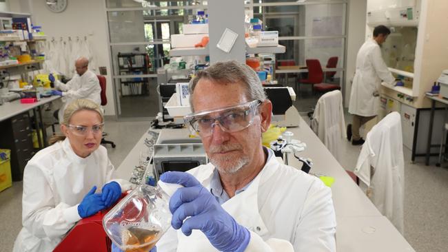 Minister Kate Jones, Dr Dan Watterson, Professor of Virology Paul Young, and Dr Keith Chappell, in the Molecular Virology Lab, where they are working on a rapid response vaccine pipeline. Picture: Liam Kidston