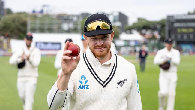 New Zealand's Glenn Phillips celebrates his five wickets as he walks from the field at the end of the Australian 2nd innings. Picture: AFP.