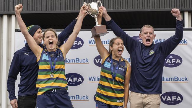 VAFA: St Kevin’s coaches and captains lift the premiership cup. Picture: Valeriu Campan