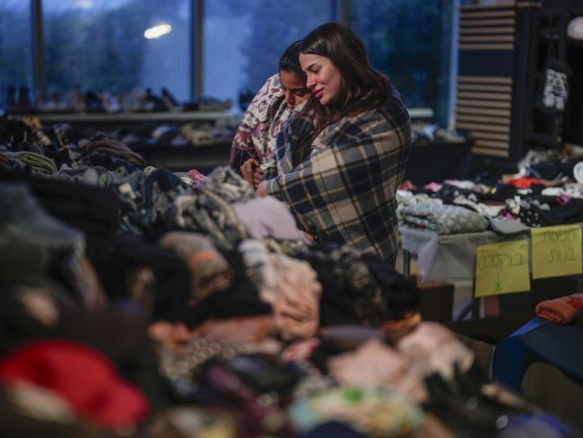 Survivors of the Nova music festival view some of the personal items recovered from the festival site that have been put on display for family and relatives to collect in Caesarea, Israel. Picture: Getty Images