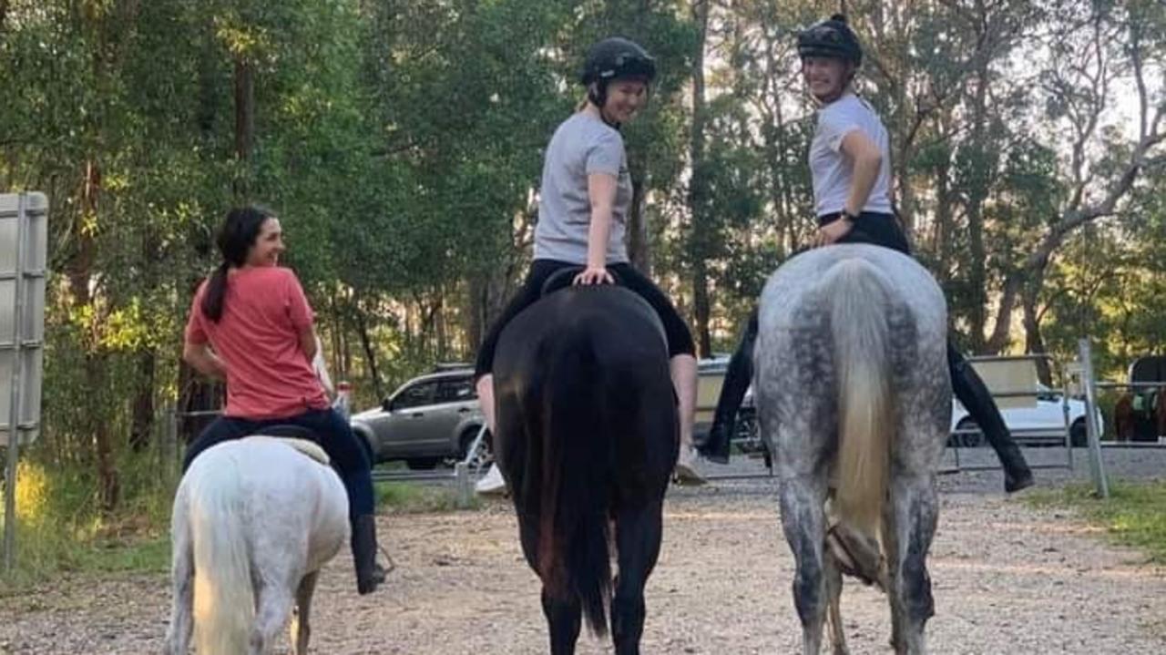 Jockey Leah Kilner riding a horse for the first time since her shocking fall with jockeys Tegan Harrison (red shirt) and Stephanie Thornton. Picture: Courtesy of the Kilner family