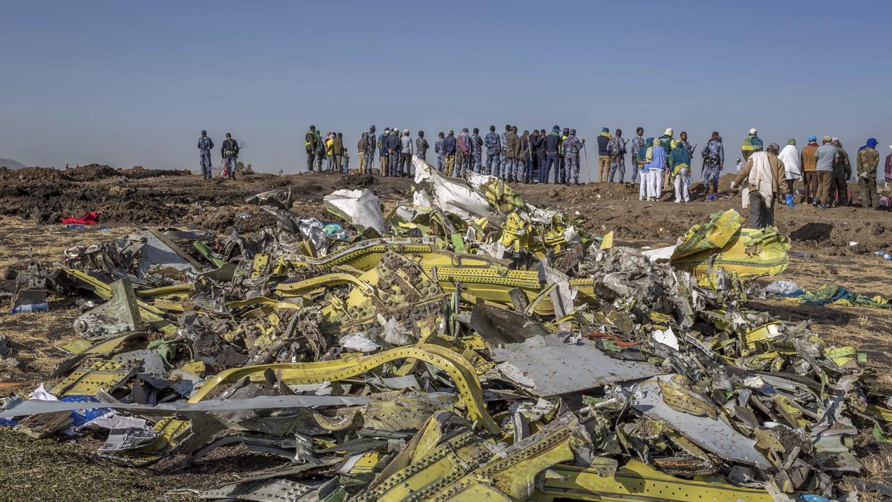 Wreckage is piled at the crash scene of an Ethiopian Airlines flight near Bishoftu, or Debre Zeit, south of Addis Ababa, Ethiopia. Picture: AP Photo/Mulugeta Ayene.