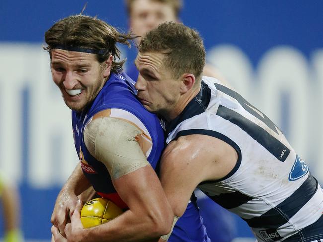 AFL Round 19 : Geelong v Western Bulldogs at Simonds Stadium. Marcus Bontempelli tackled by Joel Selwood . Pic: Michael Klein