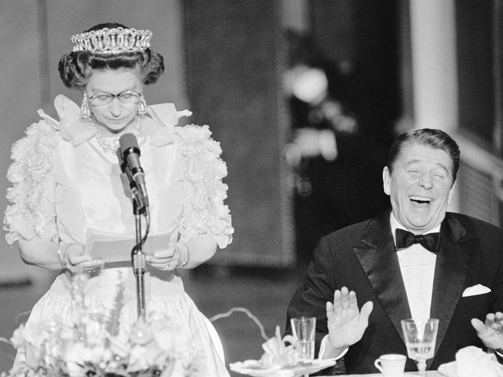 1983: President Reagan laughs following a joke by Queen Elizabeth II, who commented on the lousy California weather she has experienced since her arrival in the United States. Picture: Bettmann/Getty Images